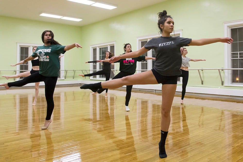 	<p>No-preference freshman Valen Yangouyian practices with the <span class="caps">MSU</span> Elite Dance Team on Jan. 16, 2014, in IM Sports-Circle. The team travels across the state to compete in multiple styles of dance. Casey Hull/The State News</p>