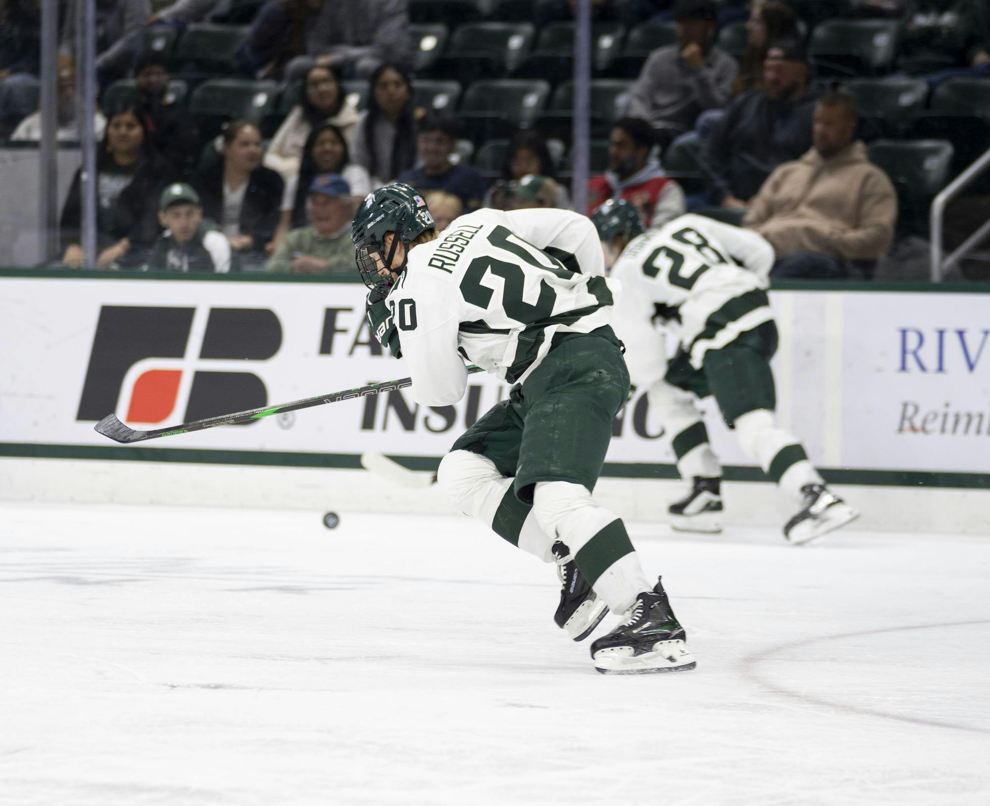 <p>MSU junior forward Daniel Russell (20) skates after the puck at Munn Ice Arena on Oct. 18, 2024.</p>