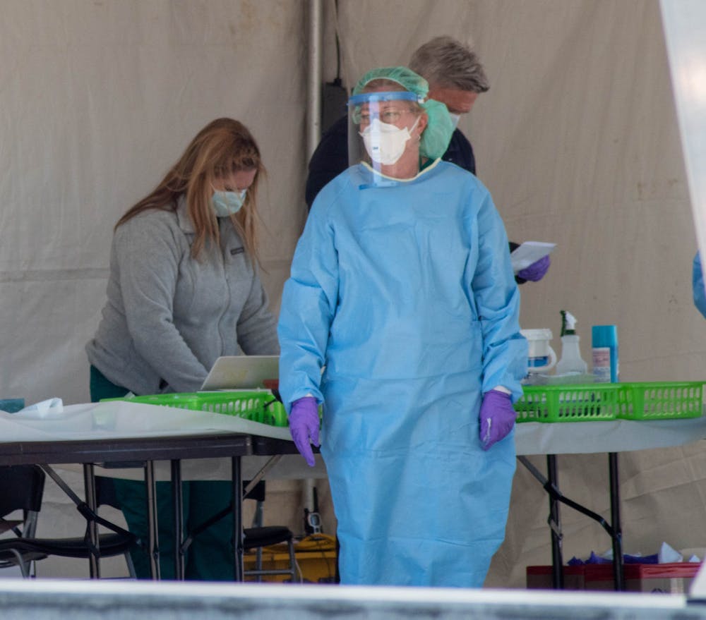 <p> A Michigan State University Health Team member preparing to test incoming patients April 2, 2020. </p>