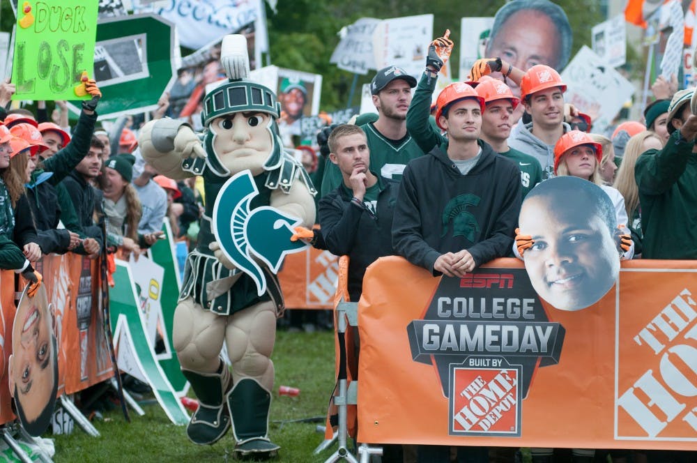 <p>Sparty walks through the crowd on Sept. 12, 2015, at ESPN's College Gameday at Munn field. Hundreds of students arrived early in the morning for a chance to see the live taping. Jack Stephan/ The State News</p>