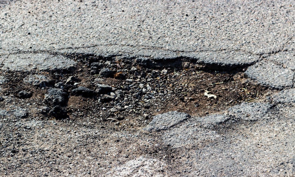 A pothole in East Lansing on March 28, 2019.