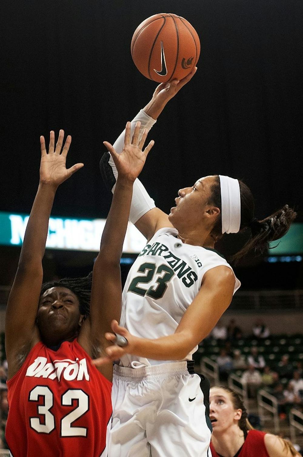 	<p>Freshman guard Aerial Powers takes a shot over Dayton guard Tiffany Johnson on Nov. 17, 2013, at Breslin Center. <span class="caps">MSU</span> defeated Dayton in overtime, 96-89. Brian Palmer/The State News</p>