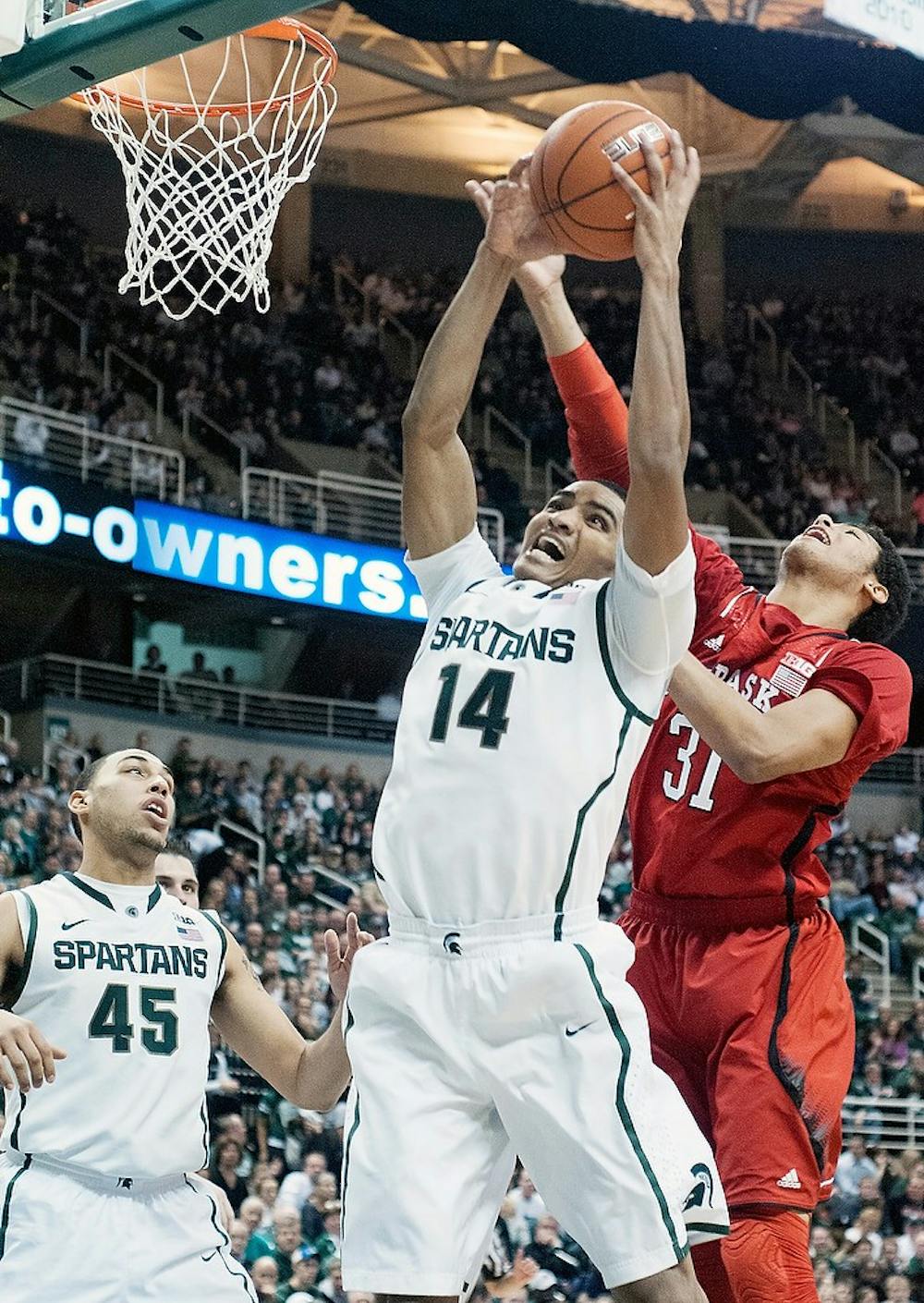 	<p>Freshman guard Gary Harris grabs a rebound before Nebraska guard/forward Shavon Shields on Jan. 13, 2013, at Breslin Center. The Spartans defeated the Huskers 66-56. Julia Nagy/The State News</p>