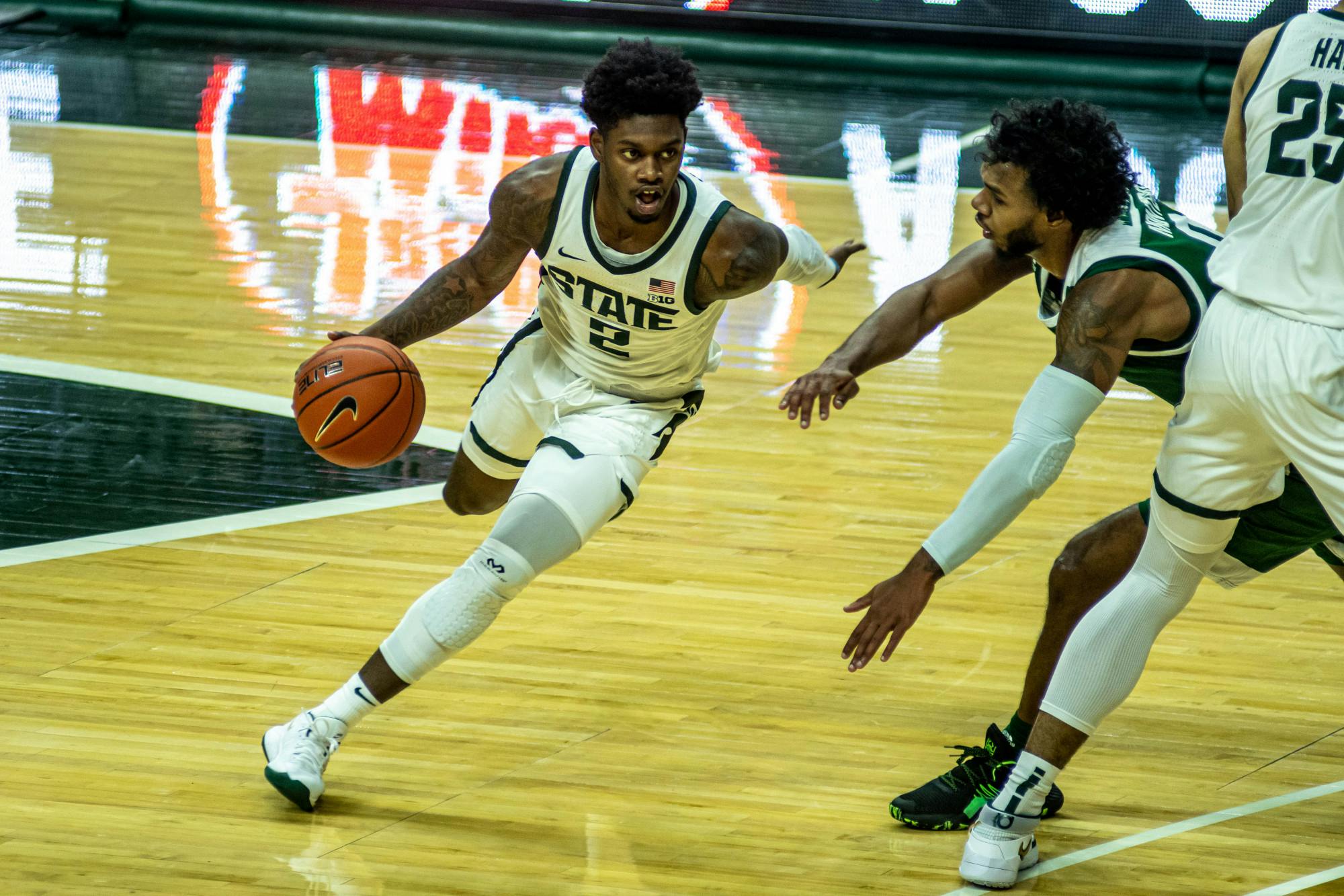 <p>Sophomore guard Rocket Watts (2) moves with the ball during the game against Eastern Michigan on Nov. 25, 2020, at the Breslin Center. The Spartans lead the Eagles 43-27 at the half.</p>