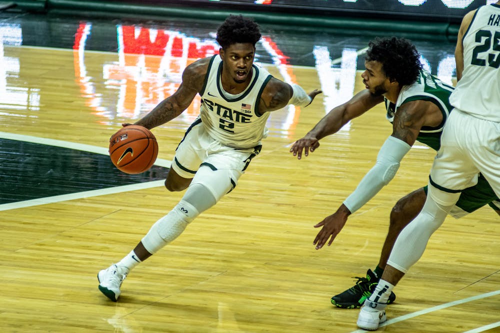 <p>Sophomore guard Rocket Watts (2) moves with the ball during the game against Eastern Michigan on Nov. 25, 2020, at the Breslin Center. The Spartans lead the Eagles 43-27 at the half.</p>
