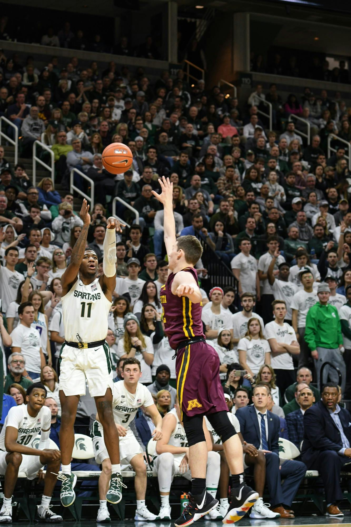 <p>Then-sophomore forward Aaron Henry (11) takes a shot during the game against Minnesota on Jan. 9, 2020, at the Breslin Center. The Spartans defeated the Golden Gophers, 74-58.</p>