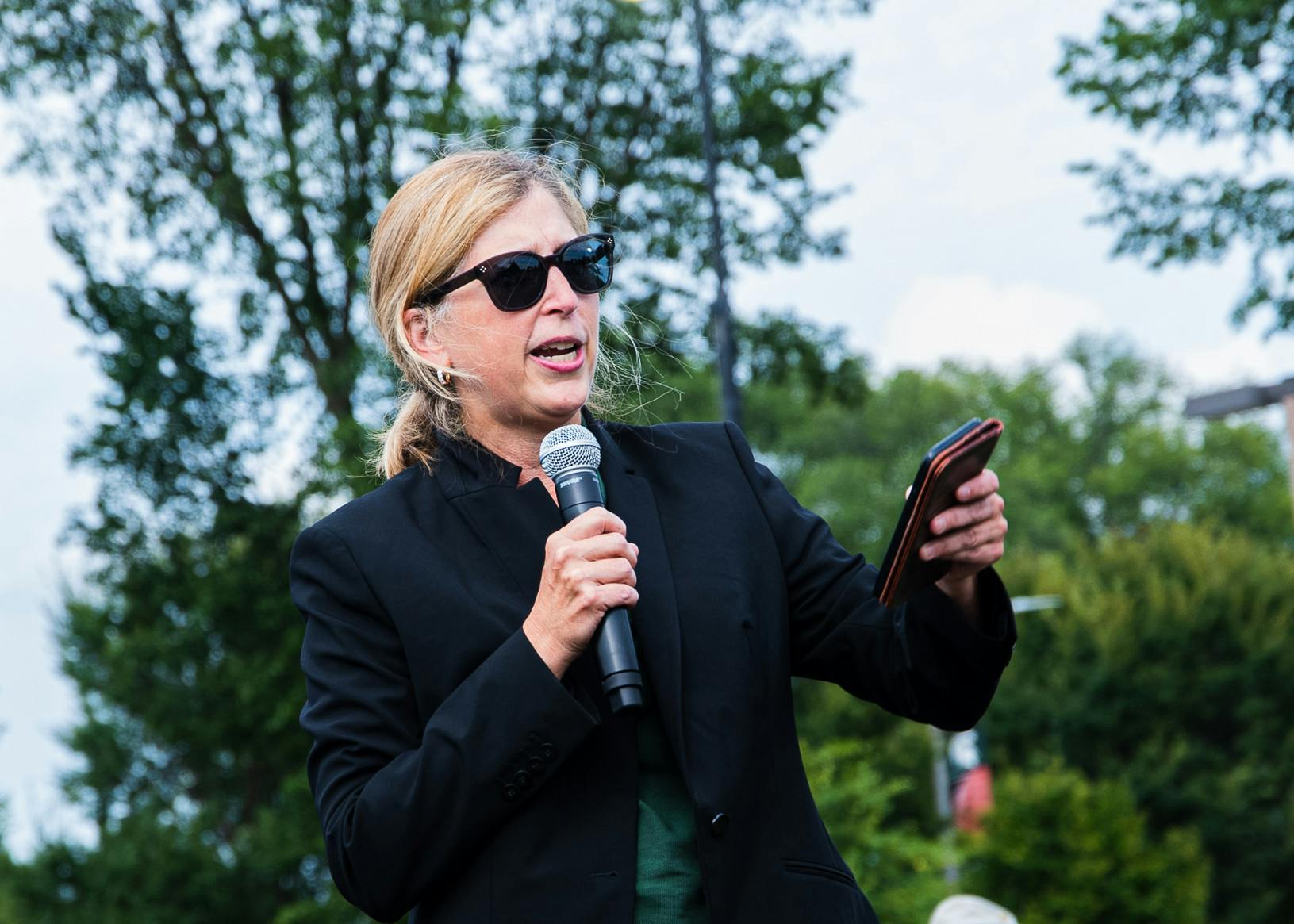 <p>Provost Teresa K. Woodruff speaks to the crowd at Sparticipation on Aug. 31, 2021. The event was held in-person at Cherry Lane Park, after being forced to move online in 2020.</p>