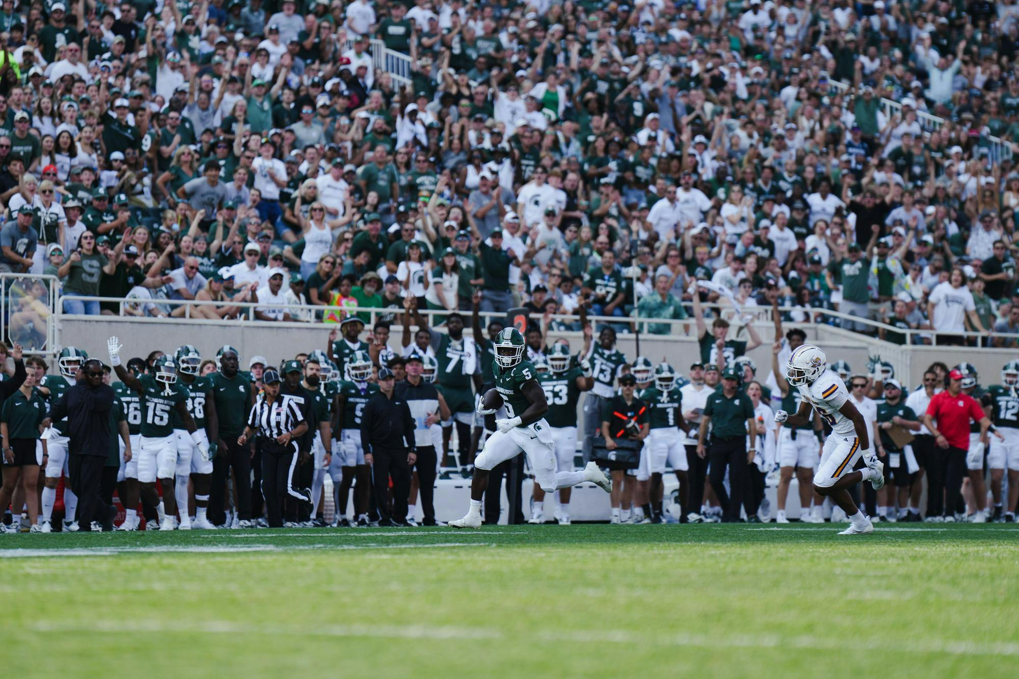 <p>MSU junior running-back Nate Carter (5) sprints down the sideline resulting in a touchdown for the Spartans at Spartan Stadium on Sept. 14, 2024</p>