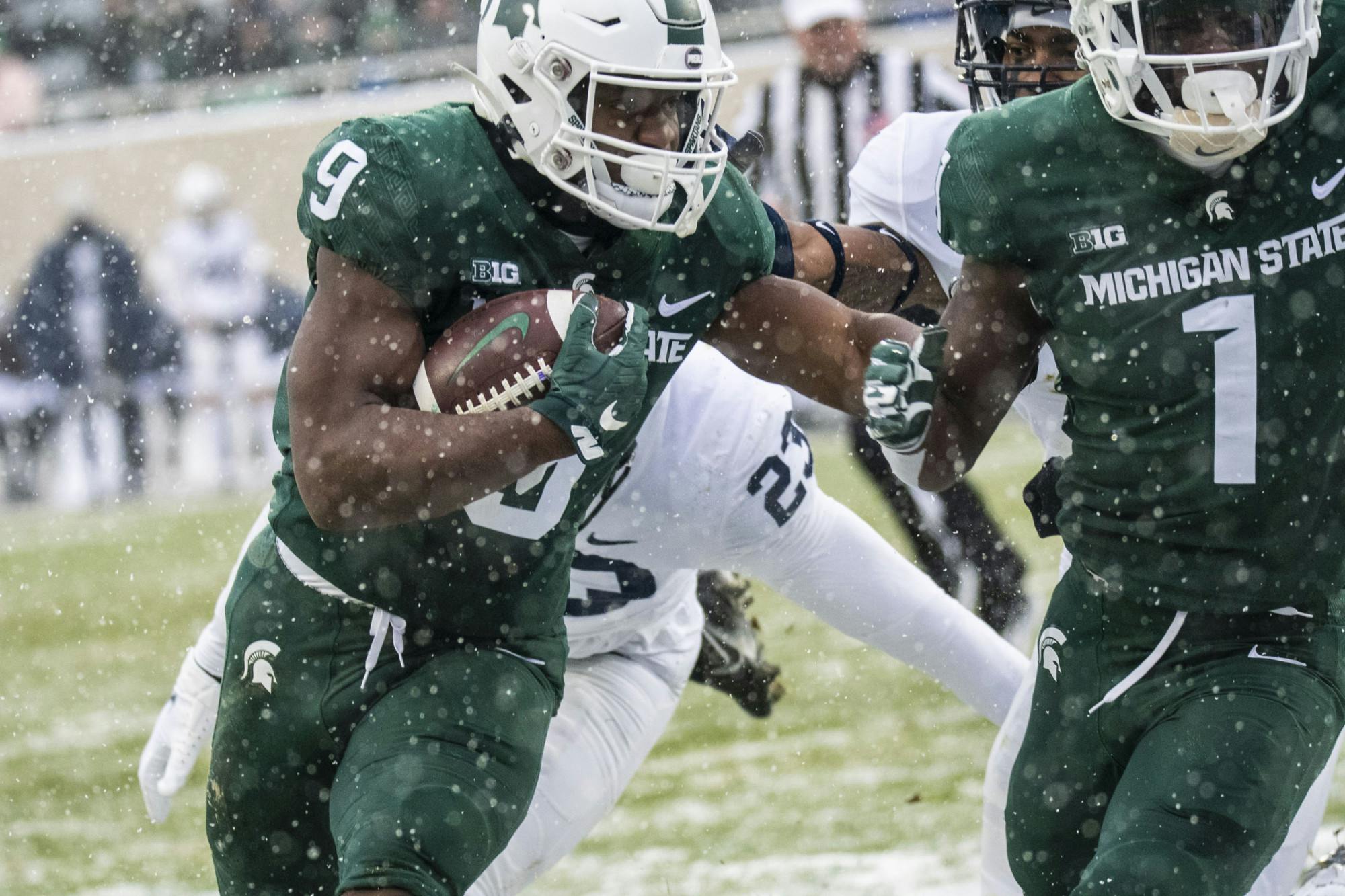 <p>Spartan junior running back Kenneth Walker (9) runs the ball in Michigan State&#x27;s match against the Penn State Nittany Lions at Spartan Stadium on Saturday, Nov. 27, 2021. </p>