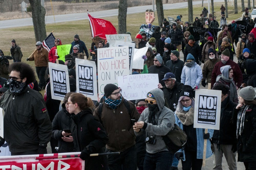 <p>Protestors march to the MSU Pavilion to stop Richard Spencer from speaking at MSU on March 5, 2018 at Lot 89. (Annie Barker | State News)</p>