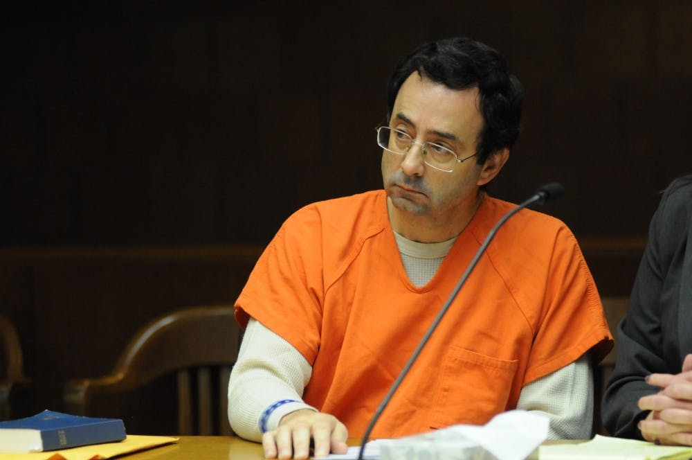 Former MSU employee Larry Nassar looks to the court during the arraignment on Feb. 23, 2017 at 55th District Court in Mason, Mich. Nassar pleaded not guilty to 23 criminal sexual assault, first degree. 