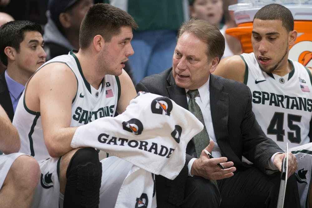 <p>Head coach Tom Izzo talks to freshman forward Kenny Kaminski on the bench March 6, 2014, at Breslin Center during the game against Iowa. The Spartans defeated the Hawkeyes, 86-76. Julia Nagy/The State News</p>