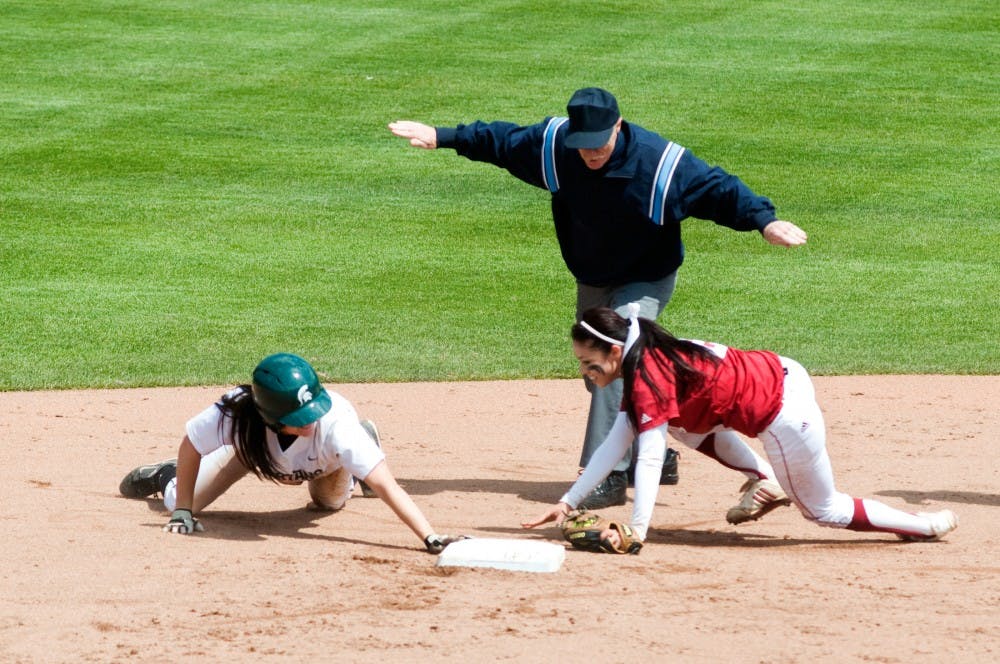 	<p>Senior shortstop Lindsey Hansen gets called safe as Indiana infielder Breanna Saucedo dives to tag her out Saturday afternoon at Secchia Stadium. The Spartans lost Saturday&#8217;s game to Indiana, 7-2. Matt Hallowell/The State News</p>
