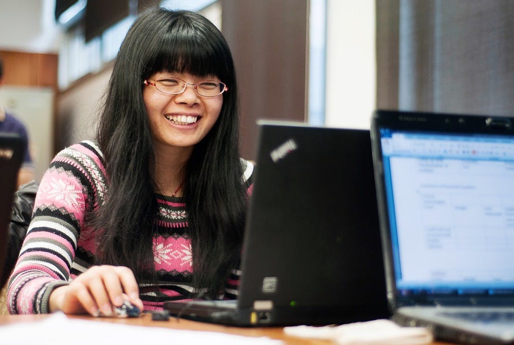 	<p>Graduate student Hui Chen works on a project with her group members in the Business College Complex. Chen, who is seeking her Masters in Business Administration, was working on a supply management project with other graduate students. Julia Nagy/The State News</p>