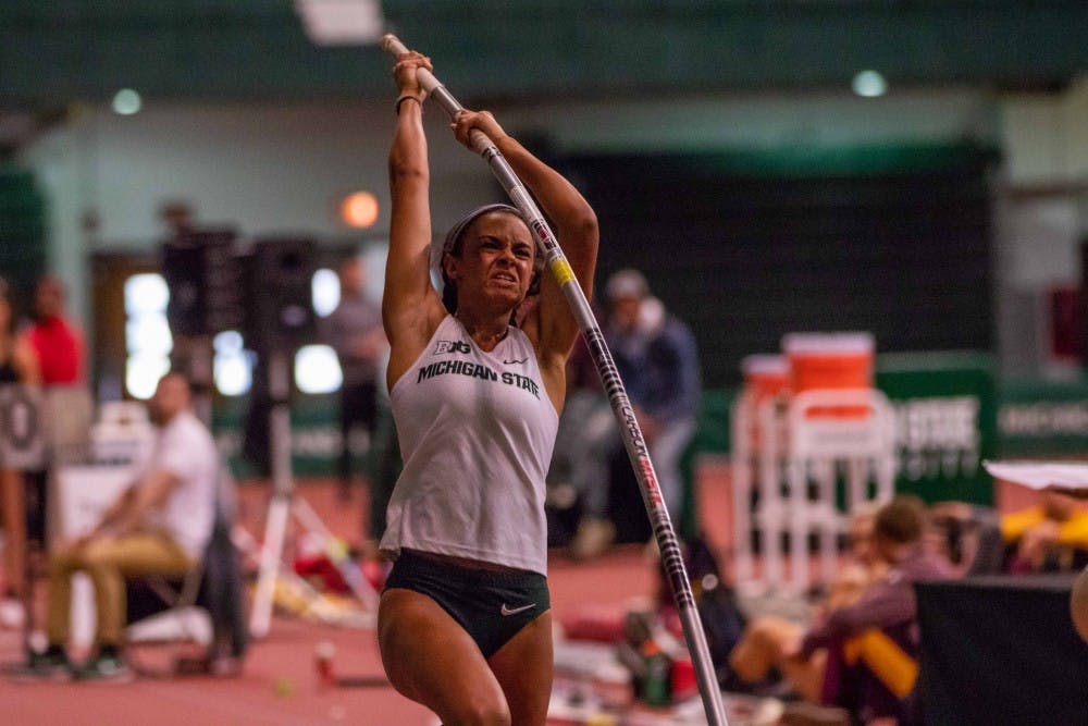 <p>Freshman Sophia Franklin competes in the pole vault on April 6, 2018 at Jenison Fieldhouse. </p>