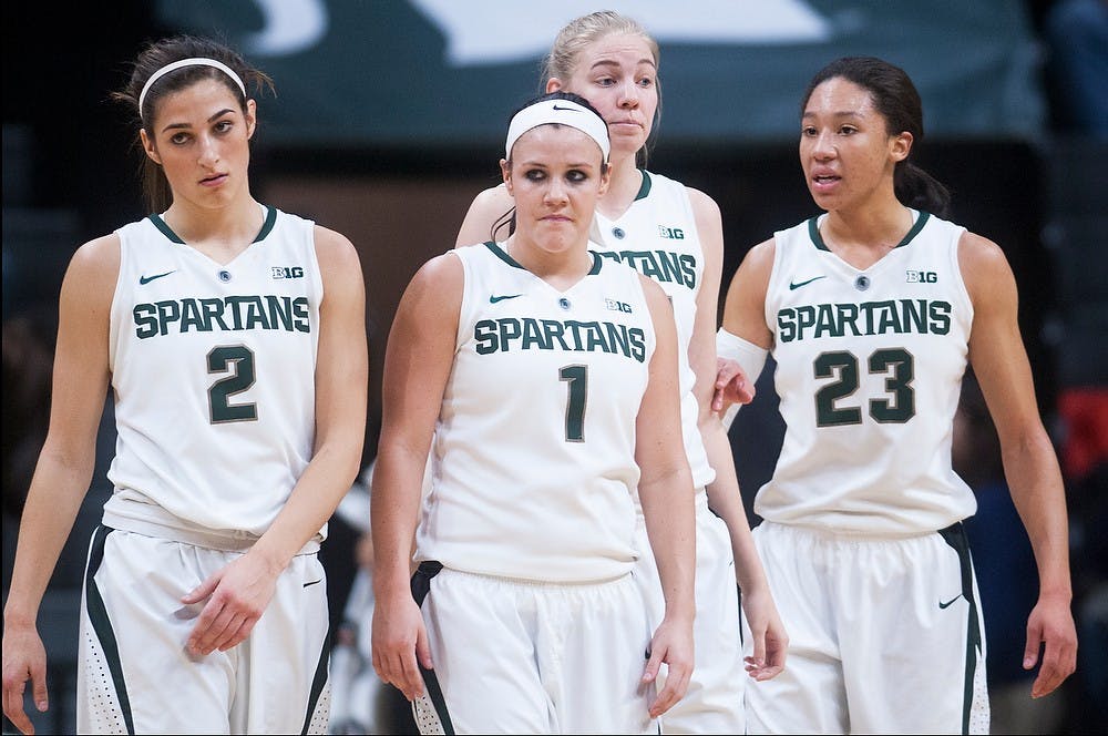 <p>Junior guard Cara Miller, sophomore guard Tori Jankoska, senior forward Kelsey Kuipers and sophomore forward Aerial Powers react to a call Feb 5, 2015, during the game against Michigan at Breslin Center. The Spartans were defeated by the Wolverines, 72-59. Kennedy Thatch/The State News</p>