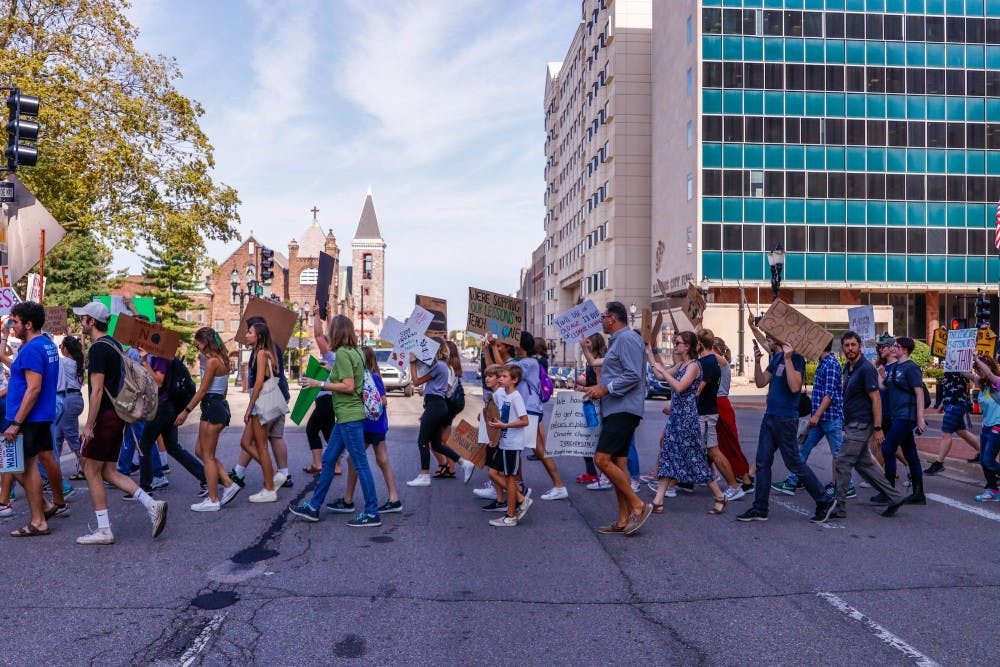<p>The crowd marches at the Global Climate Strike at the Capitol building in Lansing Sep. 20, 2019. The strike was part of a global movement started by young climate activist Greta Thunberg, that comes three days before the UN Climate Summit in NYC. </p>