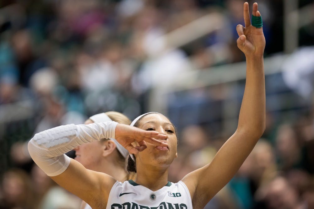 	<p>Freshman guard Aerial Powers celebrates a three-pointer by freshman guard Tori Jankoska during the game against Colgate on Dec. 29, 2013, at Breslin Center. The Spartans won, 96-46. Julia Nagy/The State News</p>