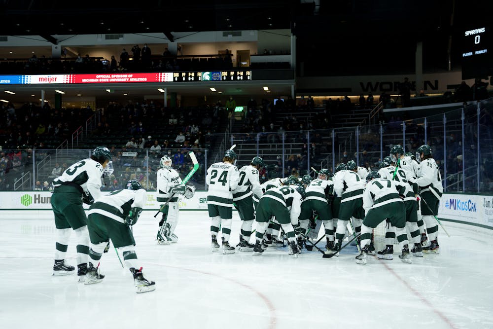 <p>Michigan State hockey team gathering around before the start of their game against Notre Dame on Feb. 18, 2022. Spartans lost 2-1 against Notre Dame.</p>