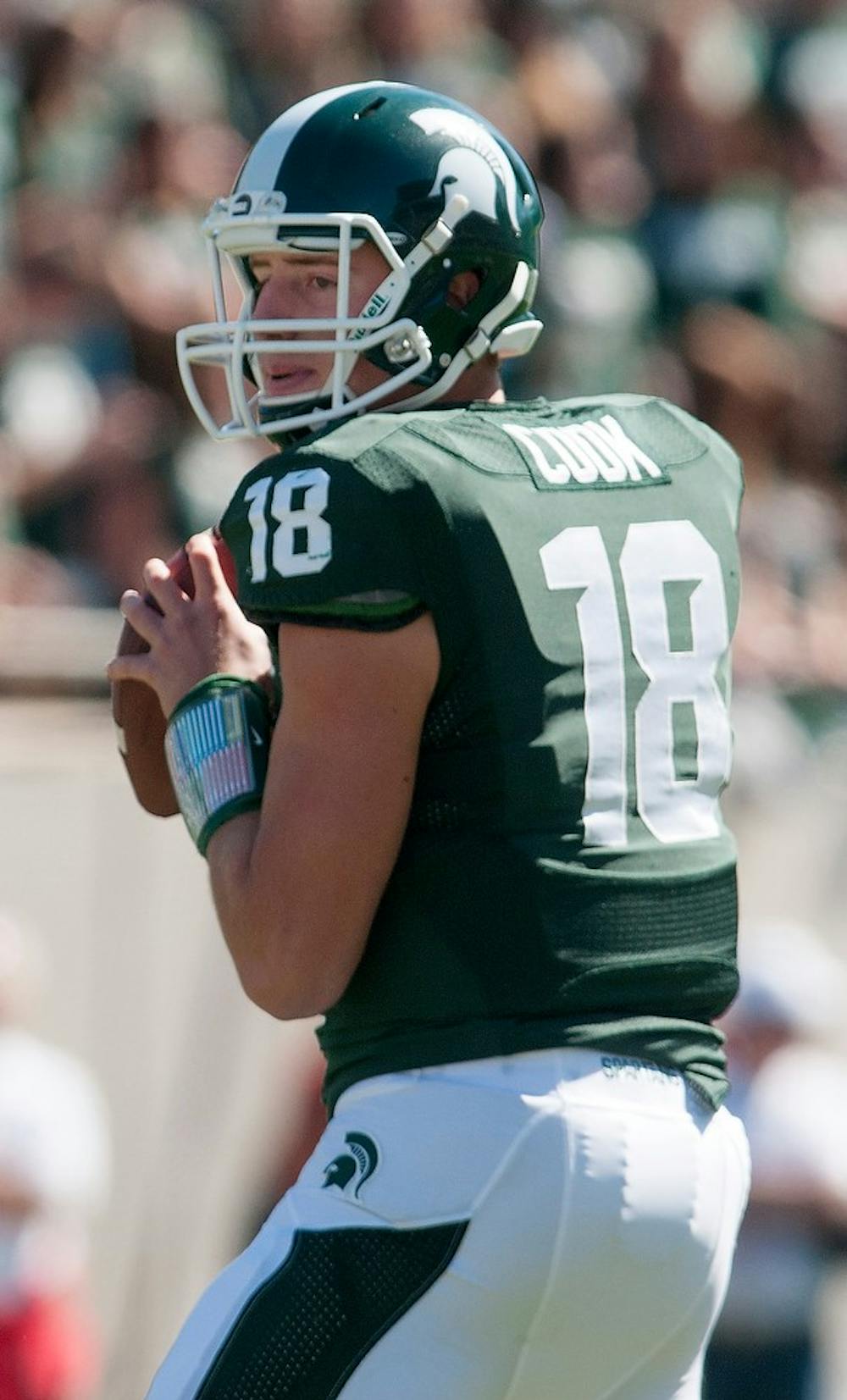 	<p>Sophomore quarterback Connor Cook looks to throw a pass on Sept. 14, 2013, at Spartan Stadium. The Spartans defeated Youngstown State, 55-17. Julia Nagy/The State News</p>