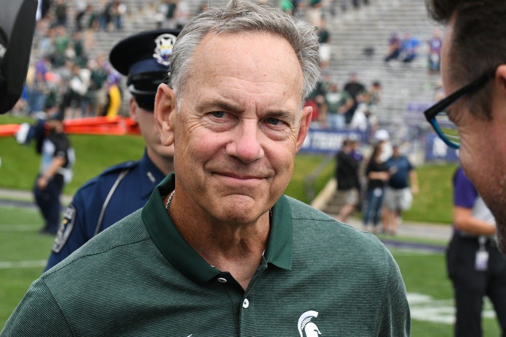 <p>MSU head coach Mark Dantonio smiles after the game against Northwestern on Sept. 21, 2019 at Ryan Field. MSU defeated Northwestern, 31-10. </p>