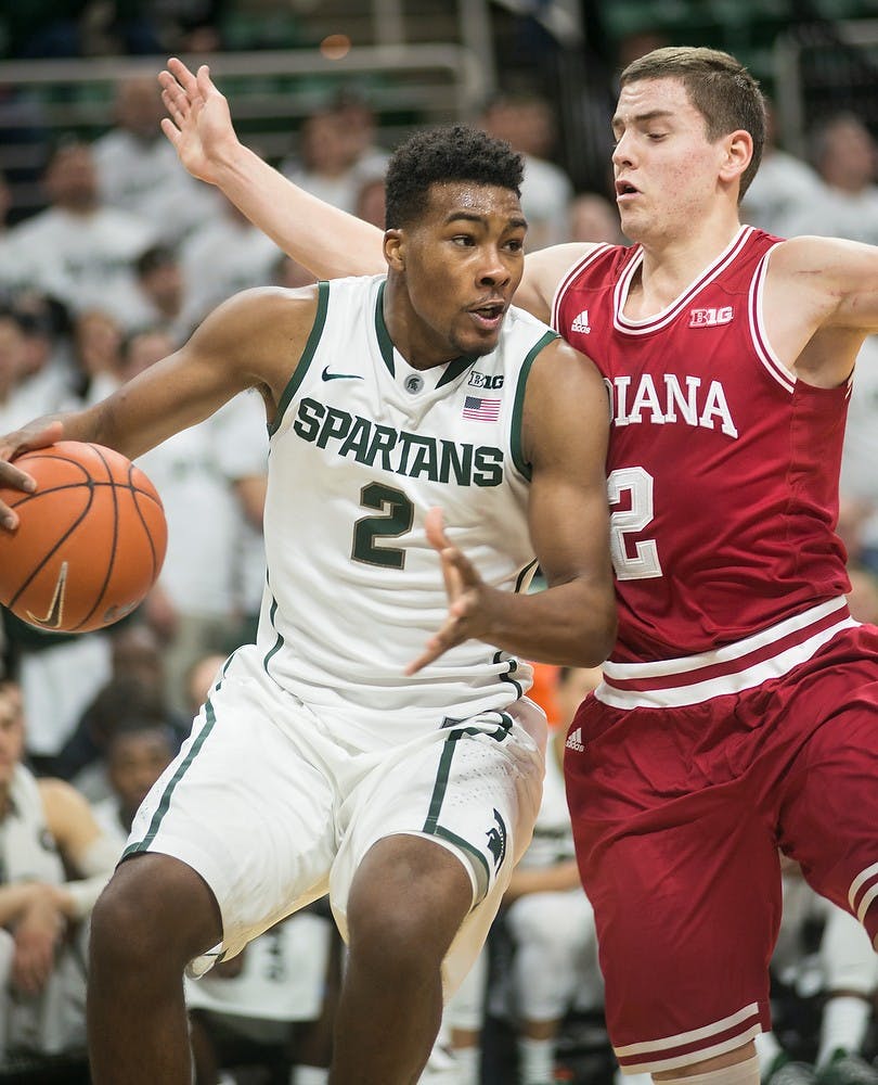 <p>Freshman forward Javon Bess tries to push past Indiana guard Nick Zeisloft Jan. 5, 2015, during the game against Indiana at Breslin Center. The Spartans defeated the Hoosiers, 70-50. Erin Hampton/The State News</p>