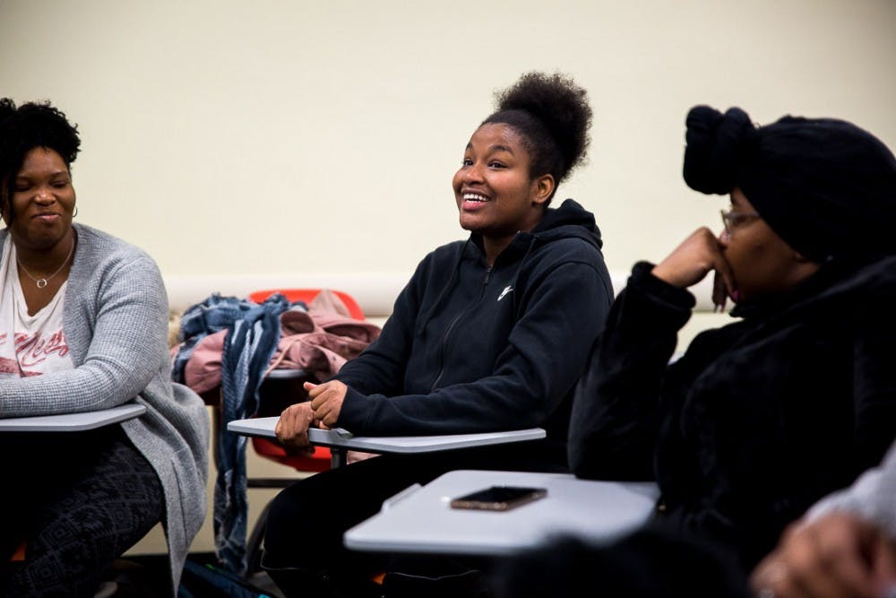 Psychology junior and event coordinator Sharon Herring talks during a Black Girls Unite meeting on Feb. 27, 2019 at the Main Library. The organization provides a safe space for black women to discuss issues surrounding black women and diversity.