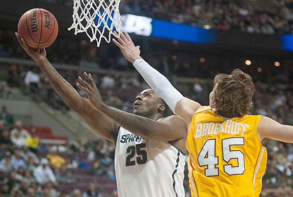 	<p>Senior center Derrick Nix makes a layup as Valparaiso forward Ryan Broekhoff plays defense. The Spartans leads the Crusaders at the half, 35-18, Thursday, March 21, 2013, at The Palace of Auburn Hills in Auburn Hills, Mich. Justin Wan/The State News</p>