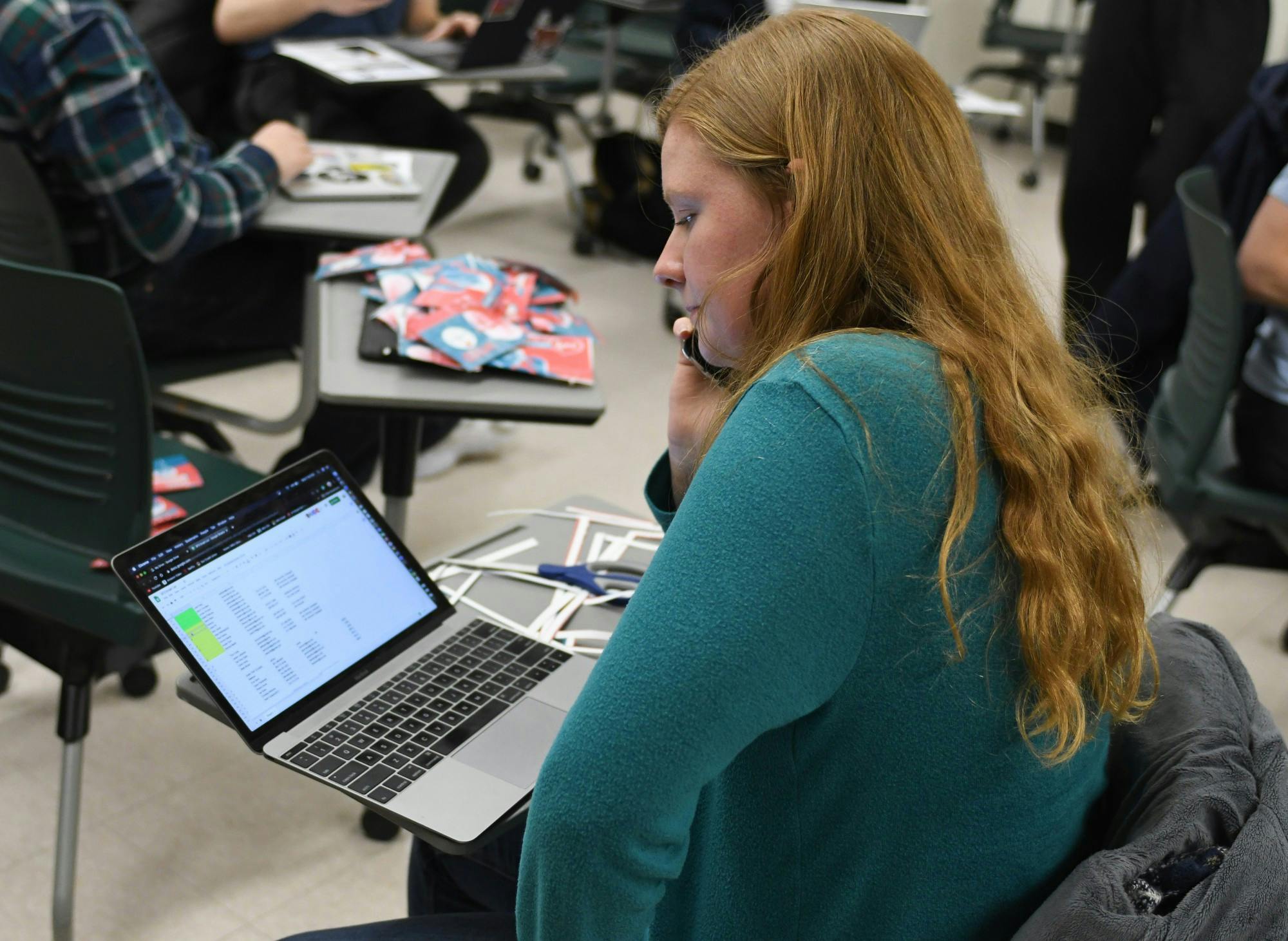 <p>Global and international studies sophomore Aurora Seelye calls potential new organization participants during the Spartans for Sanders meeting at Wells Hall on Feb.5, 2020. </p>