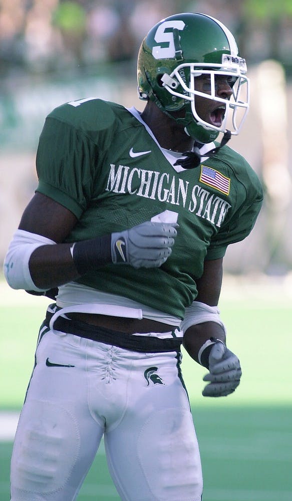 <p>Sophomore wide receiver Charles Rogers cheers after a catching the ball for a gain of 11 yards in the first quarter of the game against Michigan at Spartan Stadium on Nov. 3, 2001. The Spartans defeated the Wolverines, 26-24. Jennifer Jankowski/The State News</p>