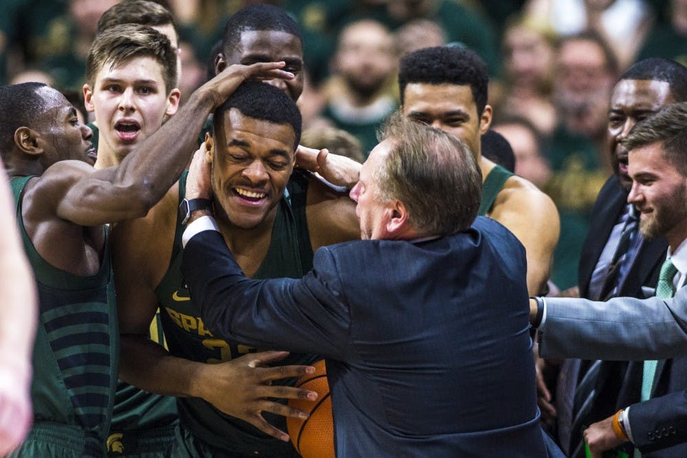 Freshman forward Xavier Tillman (23) is congratulated by his teammates and coaches after recovering a loose ball during the men's basketball game against Maryland on Jan. 4, 2018 at Breslin Center. The Spartans defeated the Terrapins, 91-61. (Nic Antaya | The State News)