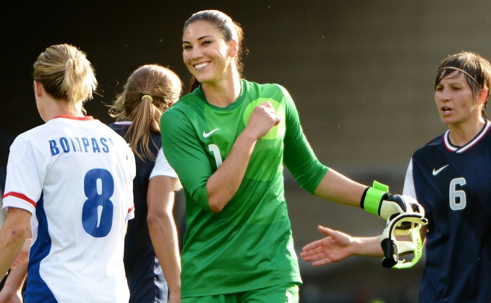 United States goalie Hope Solo, middle, is all smiles after defeating France, 4-2, in a preliminary round of the 2012 London Olympics in Glasgow, Scotland, on Wednesday July 25, 2012. (Wally Skalij/Los Angeles Times/MCT)