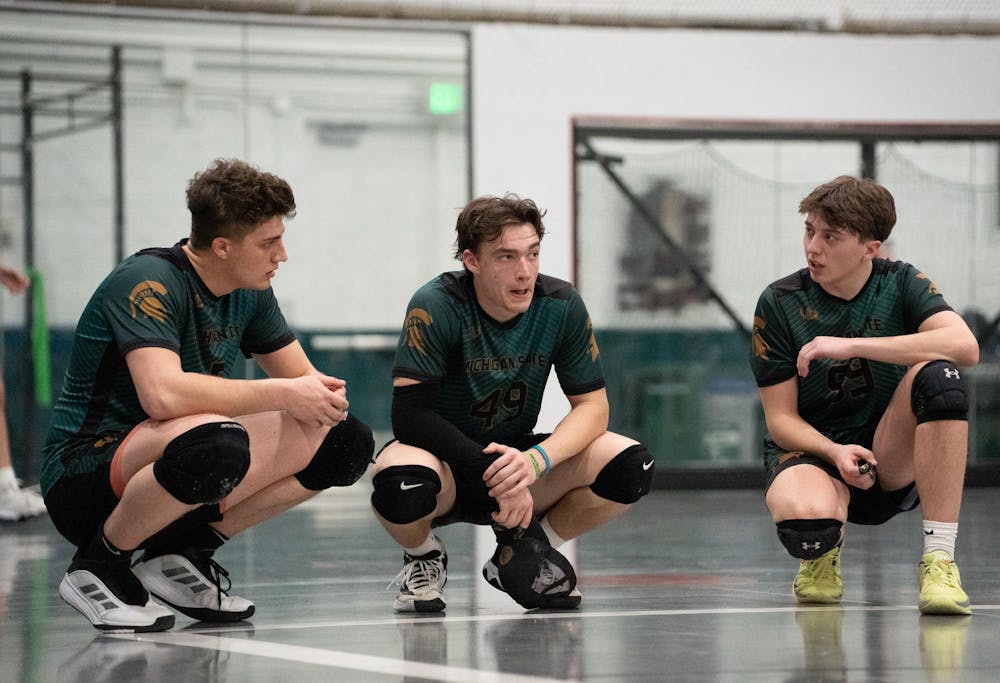 MSU club dodgeball players huddle together during the 2026 Michigan Dodgeball Cup at Demonstration Hall on Feb. 21, 2026.