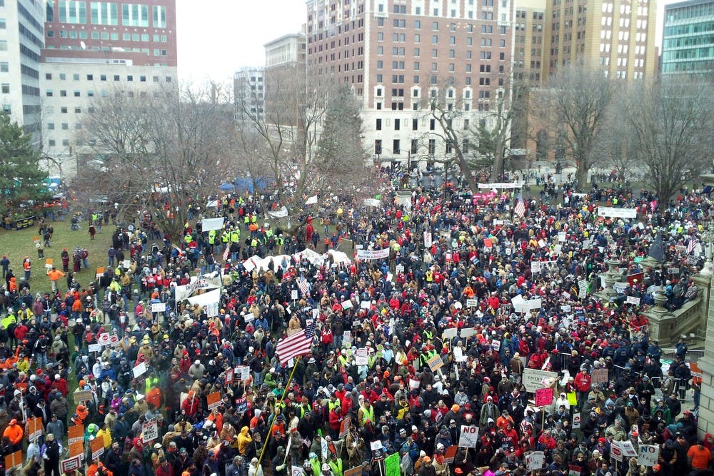 	<p>Thousands of protesters outside the state Capitol in Lansing, Michigan showed up Tuesday, Dec. 11, 2012, to protest the signing of the right-to-work bill by Gov. Rick Snyder who is supposed to sign the bill today or tomorrow. Jusin Wan/The State News.</p>