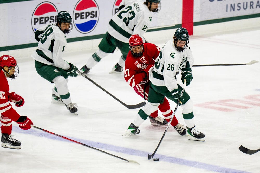 <p>Michigan State forward Eric Nilsson (26) moves the puck during a game against Wisconsin at Munn Ice Arena in East Lansing, Mich., on Saturday, Nov. 22, 2025.</p>