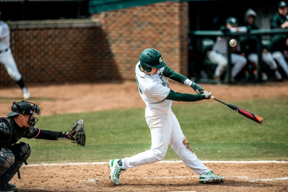 <p>Junior third baseman Marty Bechina (2) bats the ball during the game against Rutgers on March 30, 2018 at McLane Baseball Stadium. The Spartans fell to the Scarlet Knights, 6-4. &nbsp;</p>