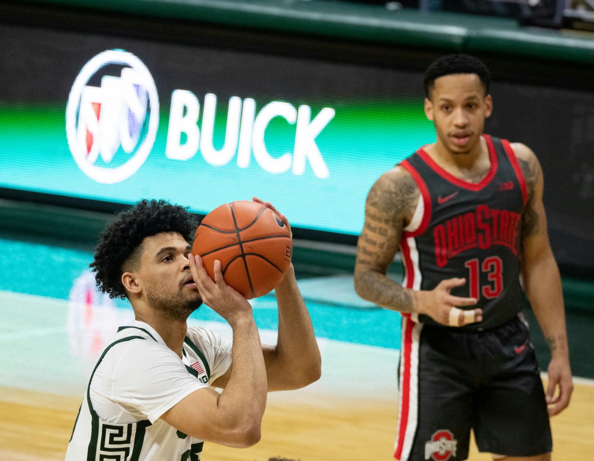 <p>Malik Hall, left, takes a free throw for MSU in a game against OSU on Feb. 25, 2021.</p>