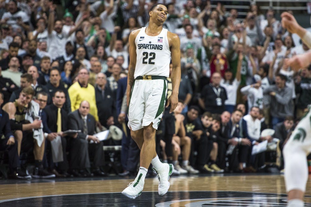 Sophomore guard Miles Bridges (22) expresses emotion after making the game winning shot during the second half of the men's basketball game against Purdue on Feb. 10, 2018 at Breslin Center. The Spartans defeated the Boilermakers, 68-65. (Nic Antaya | The State News)