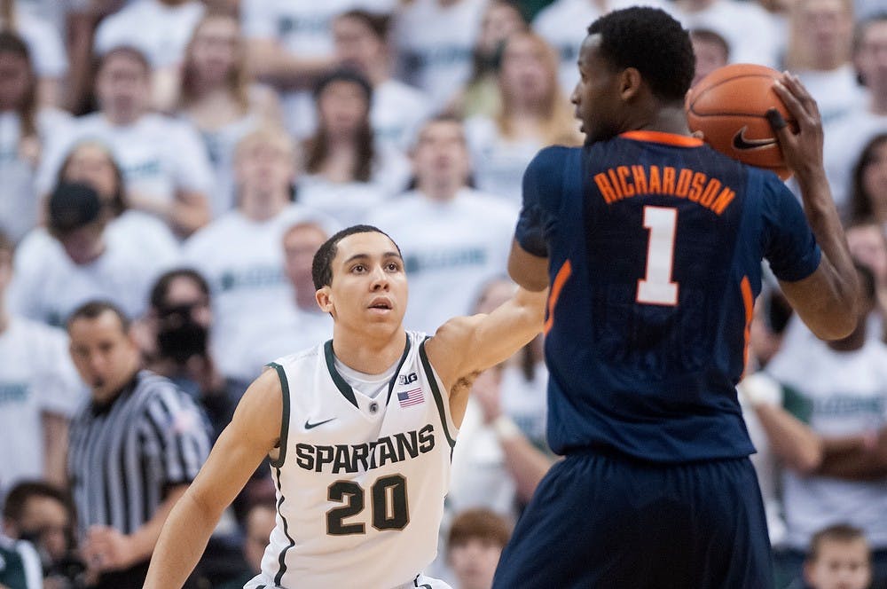 	<p>Sophomore guard Travis Trice tries to block Illinois guard D.J. Richardson on Jan. 31, 2013, at the Breslin Center. The Spartans beat the Fighting Illini 80-75. Julia Nagy/The State News</p>