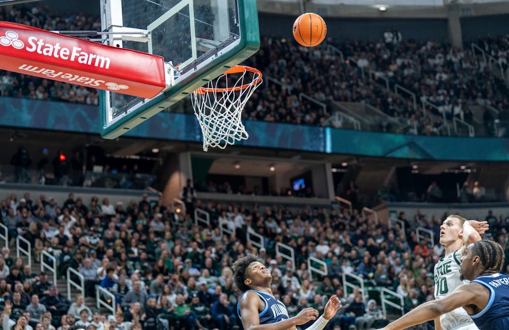 Graduate student forward Joey Hauser (10) shoots and scores during a game against Villanova at the Breslin Center on Nov. 18, 2022. The Spartans defeated the Wildcats 73-71. 