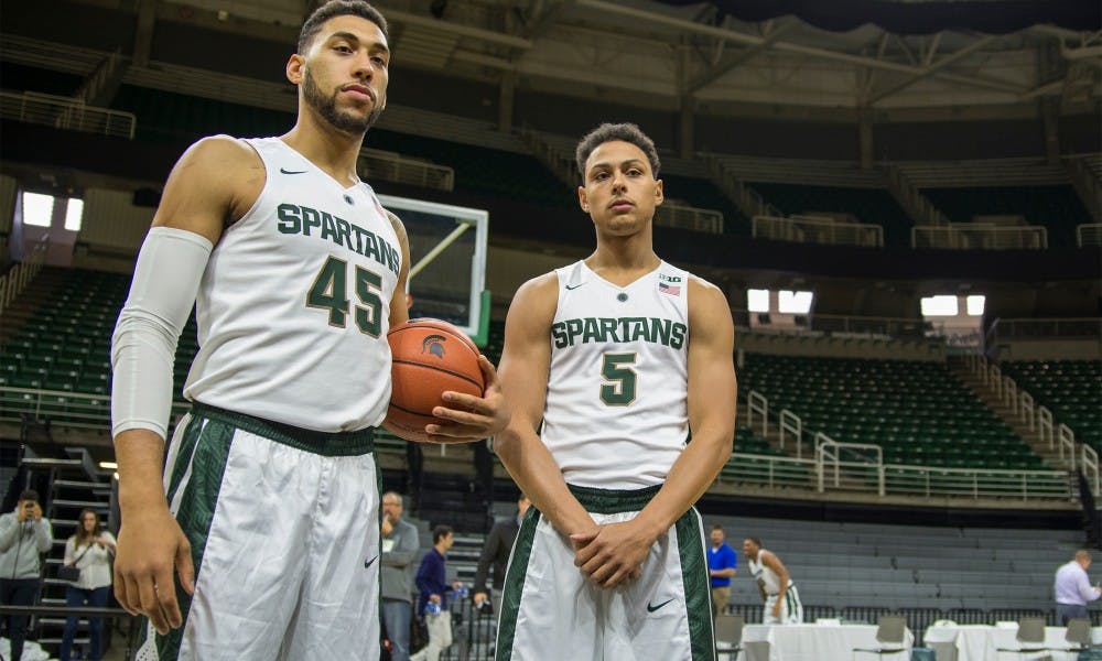 Senior guard Denzel Valentine, left, and senior guard Bryn Forbes pose for media during men's basketball media day on Oct. 27, 2015 at Breslin Center.