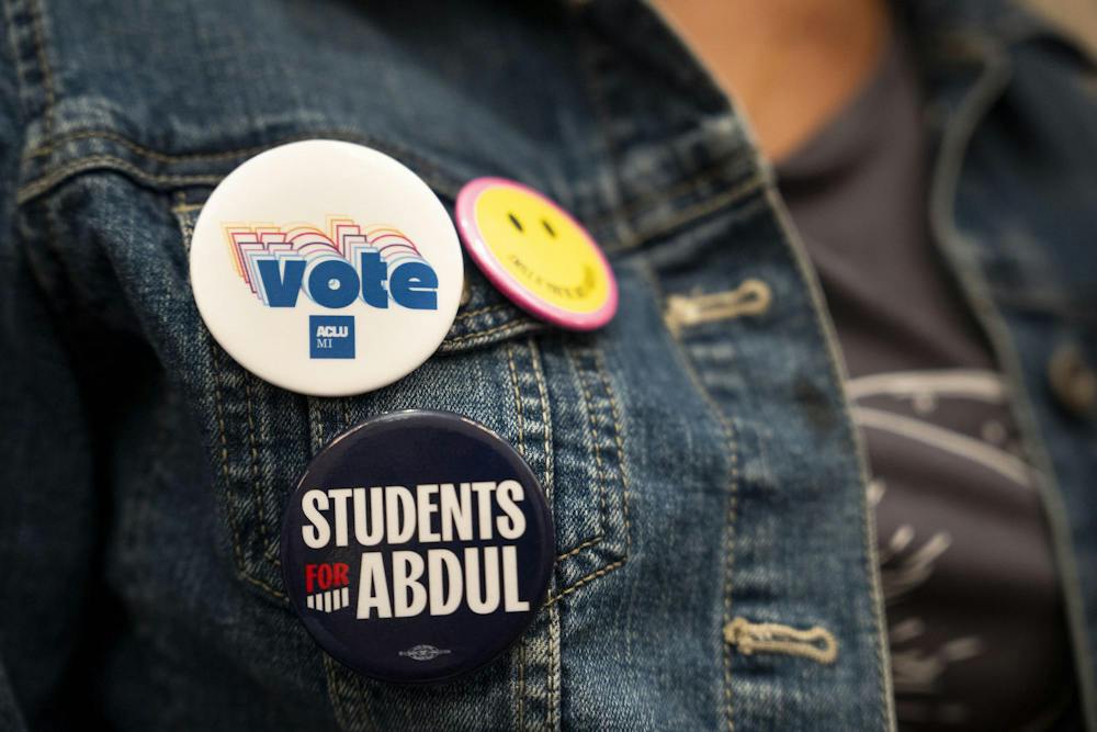 <p>Linda Burt, a marketing junior, brandishes buttons on her shirt during an Abdul El-Sayed rally at the MSU Union in East Lansing, Mich., on Sept. 11, 2026.</p>