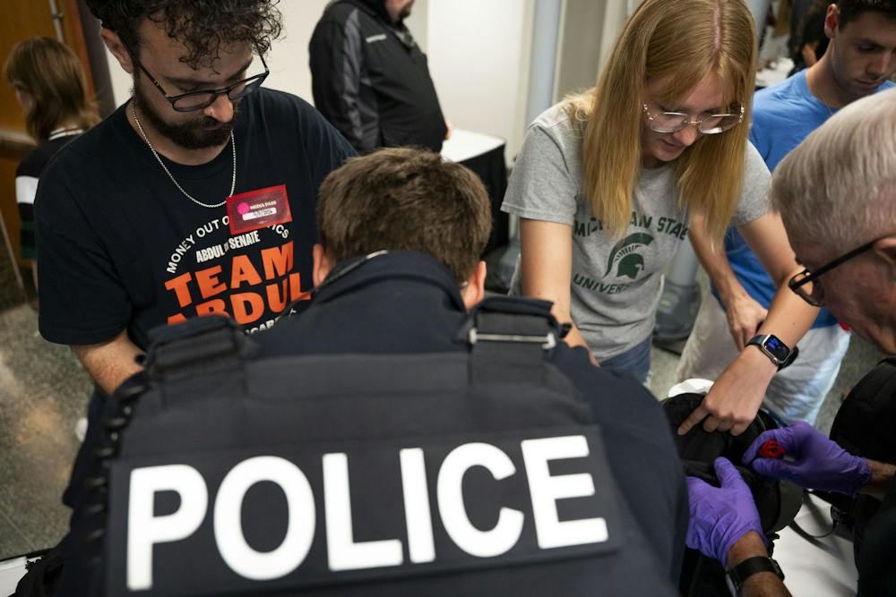 <p>Michigan State Police search the bags of media and rally attendees before an Abdul El-Sayed rally at the MSU Union in East Lansing, Mich., on Sept. 11, 2026.</p>
