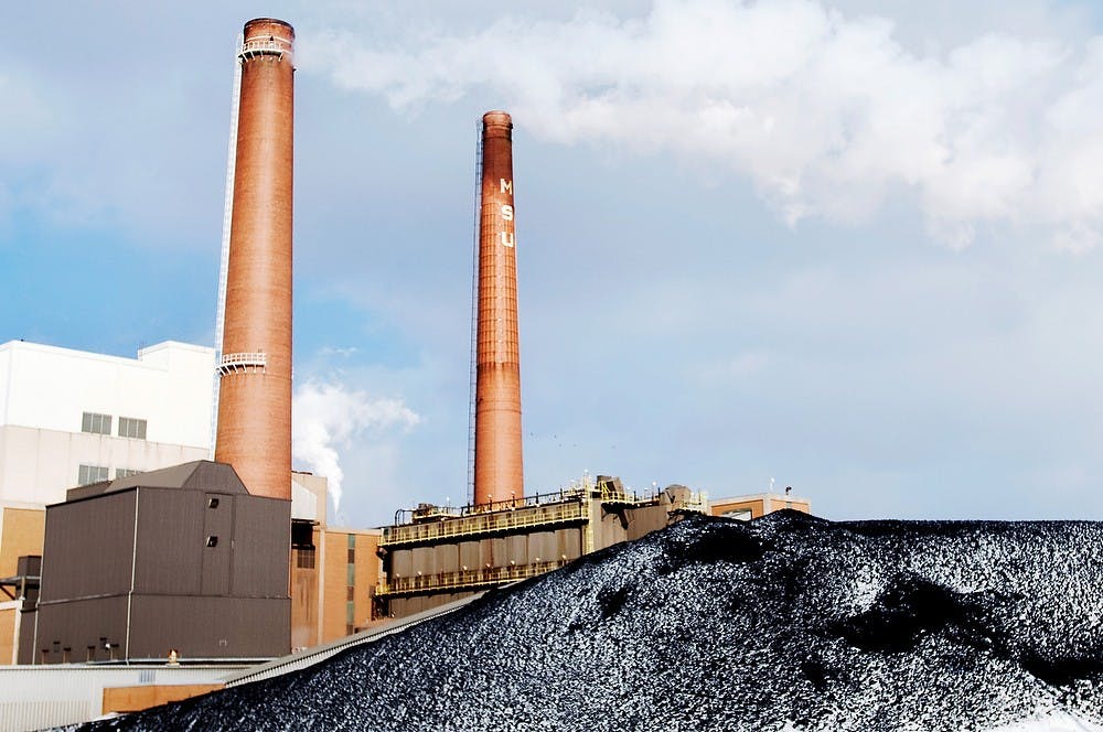 	<p>A pile of coal rests at the base of the T.B. Simon Power Plant on Jan. 19. 2012. <span class="caps">MSU</span> officials recently announced a goal to use 100 percent renewable energy in the future. State News File Photo</p>