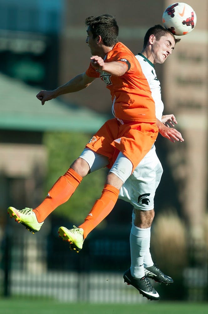 	<p>Sophomore midfielder Jay Chapman heads the ball before Bowling Green midfielder Joey D&#8217;Agostino during the game, Sept. 18, 2013, at DeMartin Stadium at Old College Field. The Spartans defeated the Falcons, 1-0. Danyelle Morrow/The State News</p>