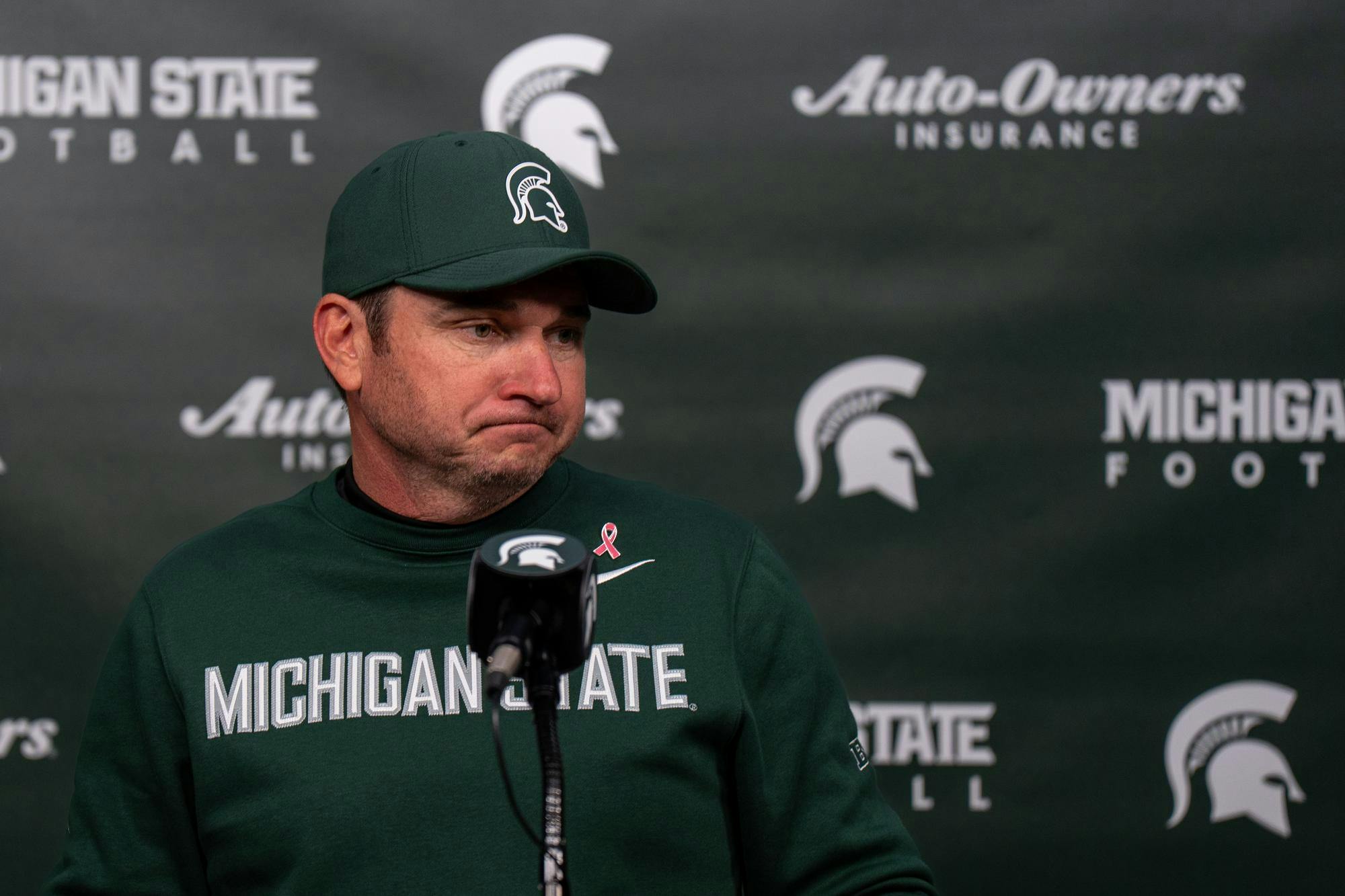 Michigan State head coach Jonathan Smith gets emotional during a press conference after the Michigan State University verses University of Michigan at Spartan Stadium in East Lansing, Michigan on Saturday, Oct. 25, 2025. 