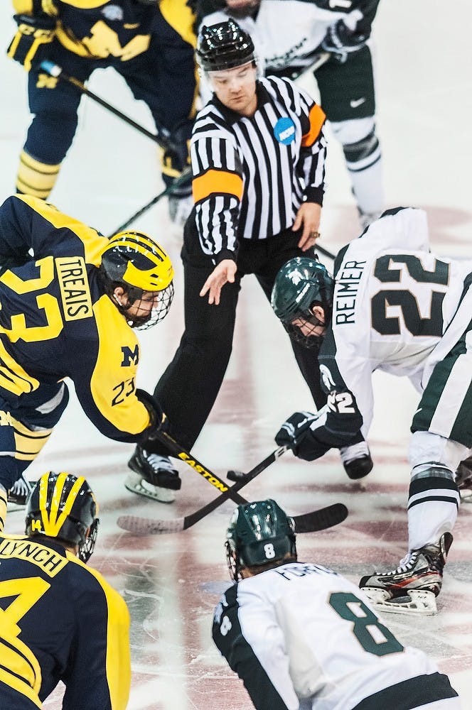 	<p>Junior center Lee Reimer faces off against Michigan center A.J. Treais on Sunday, Dec. 30, 2012, at Joe Louis Arena in Detroit. The Wolverines defeated the Spartans 5-2 during the Great Lakes Invitational third place game. Adam Toolin/The State News</p>