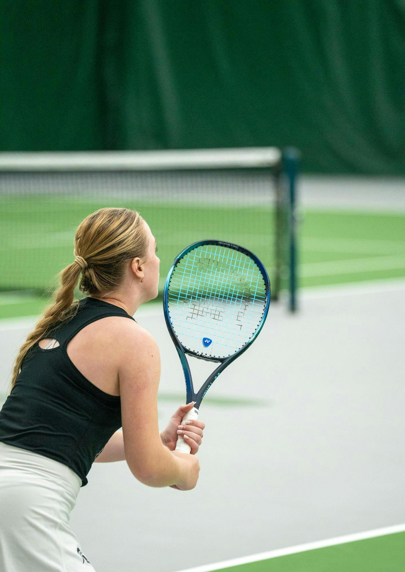 <p>A Michigan State player prepares to return a serve during one of the team's final home matches against Washington at the MSU Tennis Center on April 12, 2025.</p>
