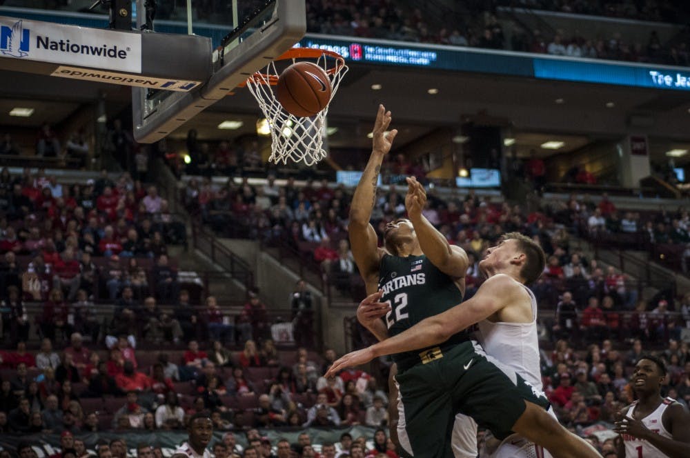 Freshman forward and guard Miles Bridges (22) is fouled as he goes up for a layup during the game against Ohio State on Jan. 15, 2017 at the Jerome Schottenstein Center. The Spartans were defeated by the Buckeyes, 67-72.