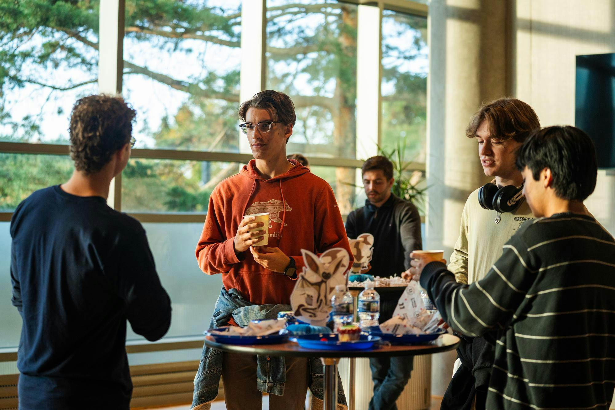 Joshua Veneziano, left, Ian Sciturro, and friends laugh and talk about the world of Avatar: The Last Airbender before the concert at the Wharton Center in East Lansing, Michigan, on Oct. 7, 2025.